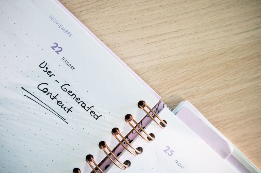 Home Open planner showing a date with handwritten notes on a wooden desk.